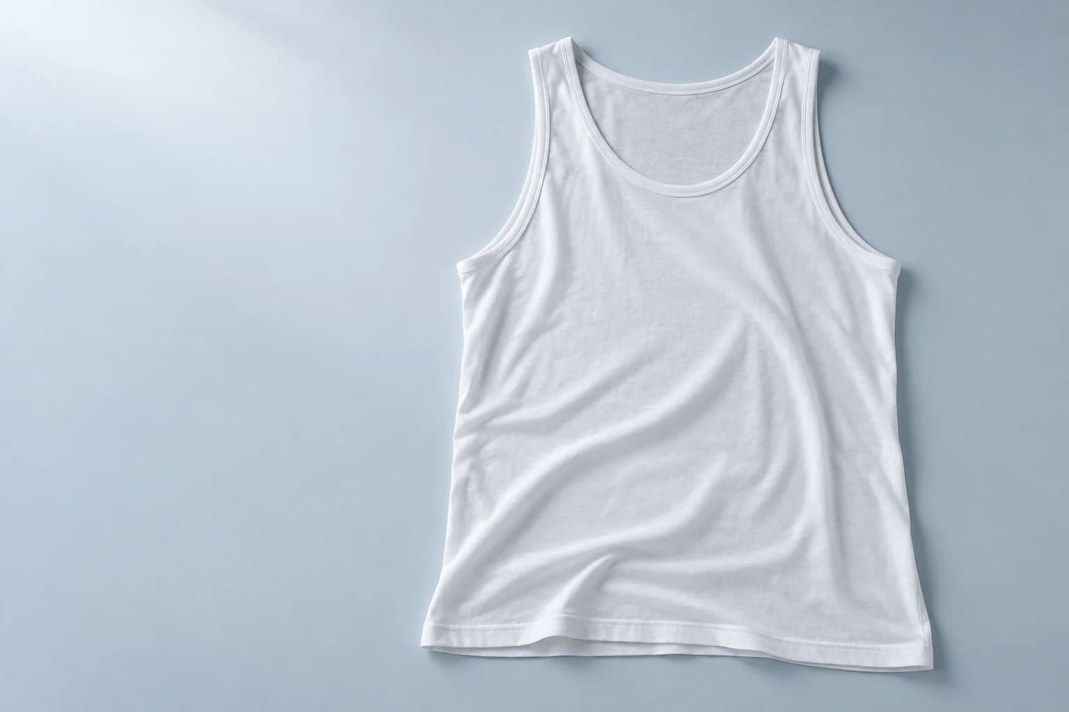 Concept image of the Disposura Base disposable undershirt, a lightweight white sleeveless layer